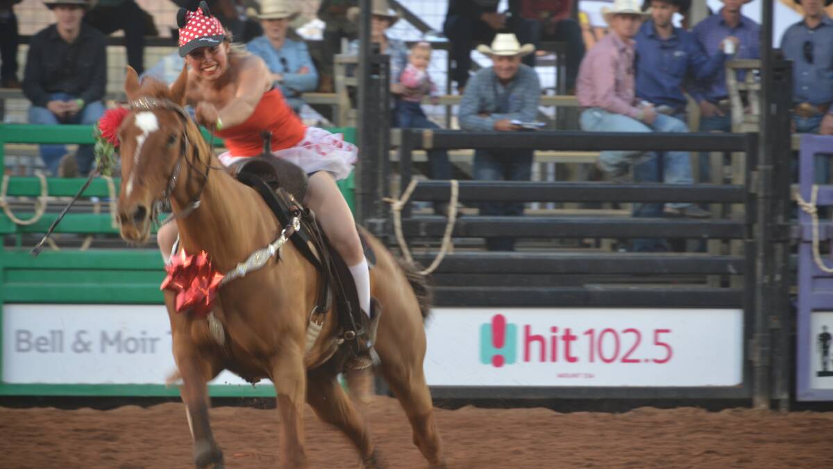 RED RIOT: The op shop barrel race on Friday is always a popular and colourful part of the Isa Rodeo. Photos: Derek Barry