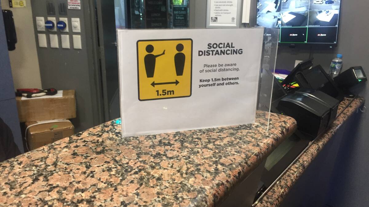 Sign at the entrance to the Buffs encouraging social distancing measures.