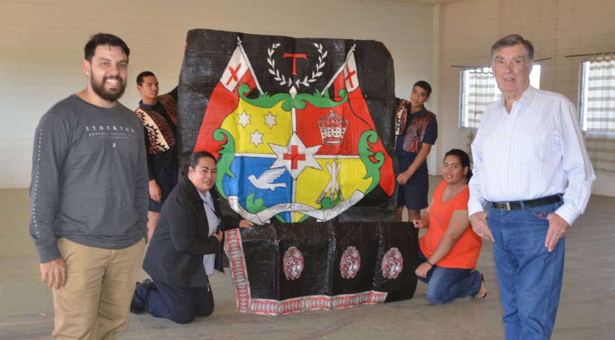DECK THE HALL: James Bambrick, Tony McGrady and members of the Tongan community at the hall. Photo: Derek Barry