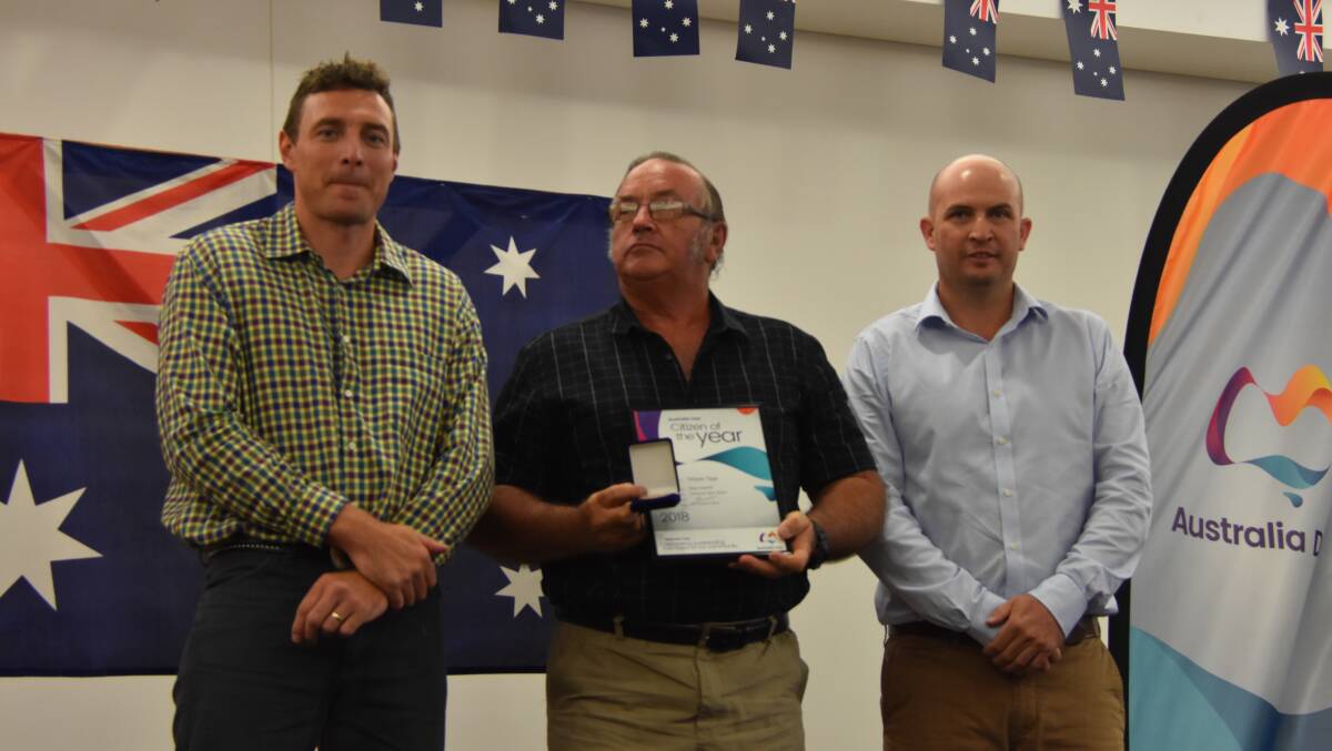 Wayne Tapp accepts his 2018 Cloncurry’s Citizen of the Year award from Josh Arnold and Mayor Greg Campbell.