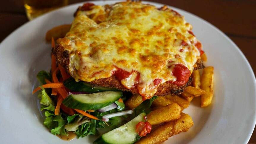 Mount Isa Tourism Association wants people to wrap their laughing gear around a pub parmi and post their experience to social media.