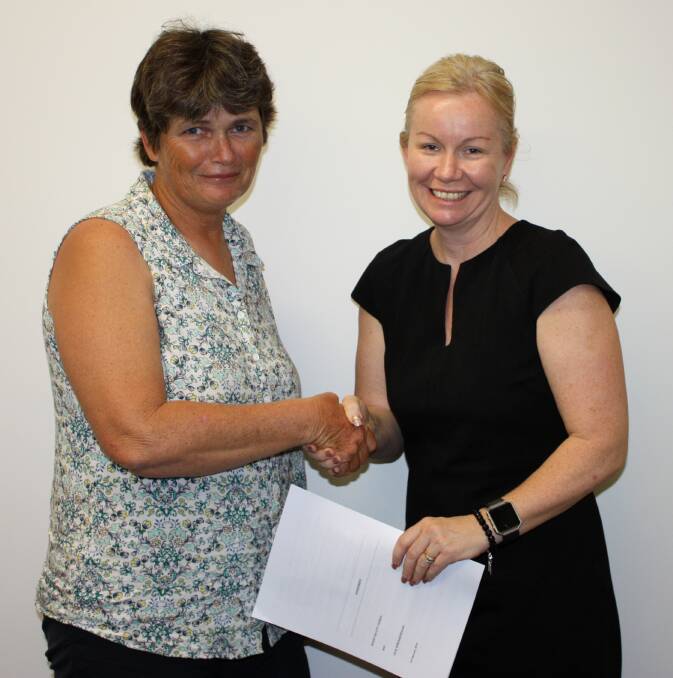 Julie Spreadborough and Cr Peta MacRae with the signed agreement.