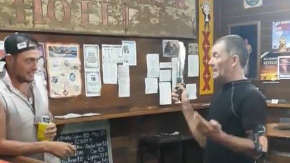 Tony Mangan recreates Paul Hogan's Crocodile Dundee knife scene in the McKinlay pub.