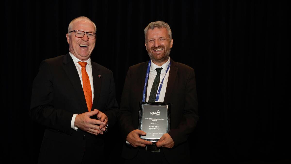 PRESENTATION: LGAQ president and Sunshine Coast Mayor Mark Jamieson presents Derek Barry with his journalism award.
