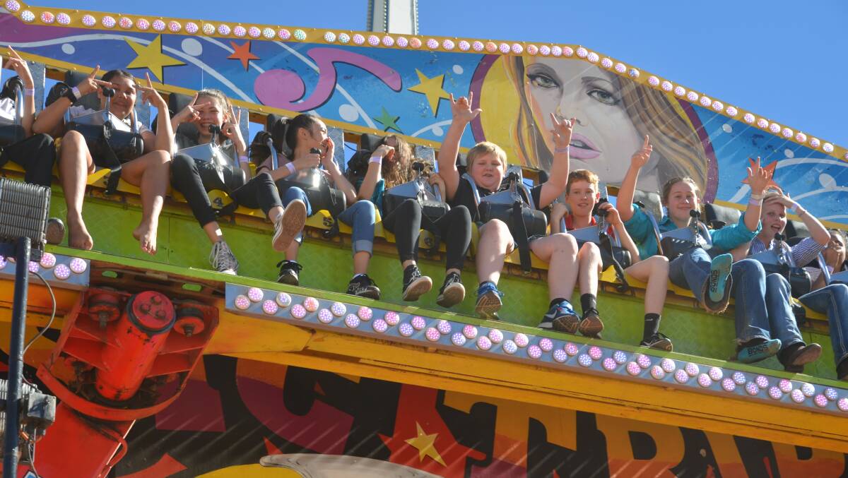 UP THERE: Kids enjoy a high ride at the recent Cloncurry and District Show. Photo: Derek Barry