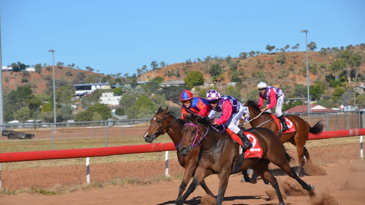 CLOSE ONE: Anchor Chain (2) pips Bowie Rocks to win Race 4 the Coppermart. Photo: Derek Barry