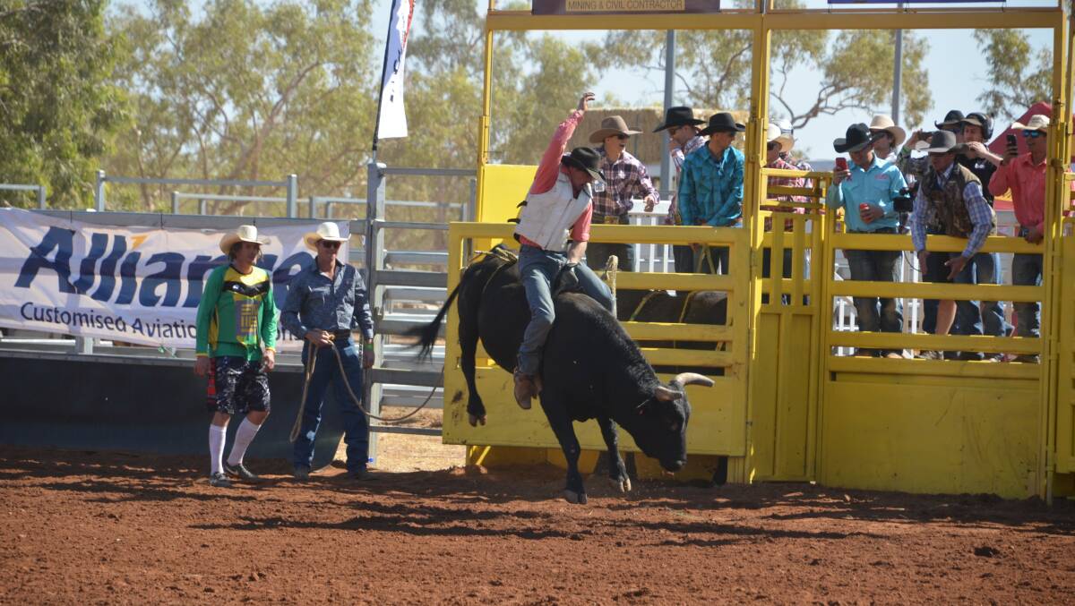 EIGHT SECONDS: Eddie Ironside finished join winner in the 2nd Div Bull Ride with Dylan Richardson. Photo: Derek Barry
