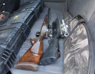 Police said a search of of the arrested man's vehicle located seven firearms.