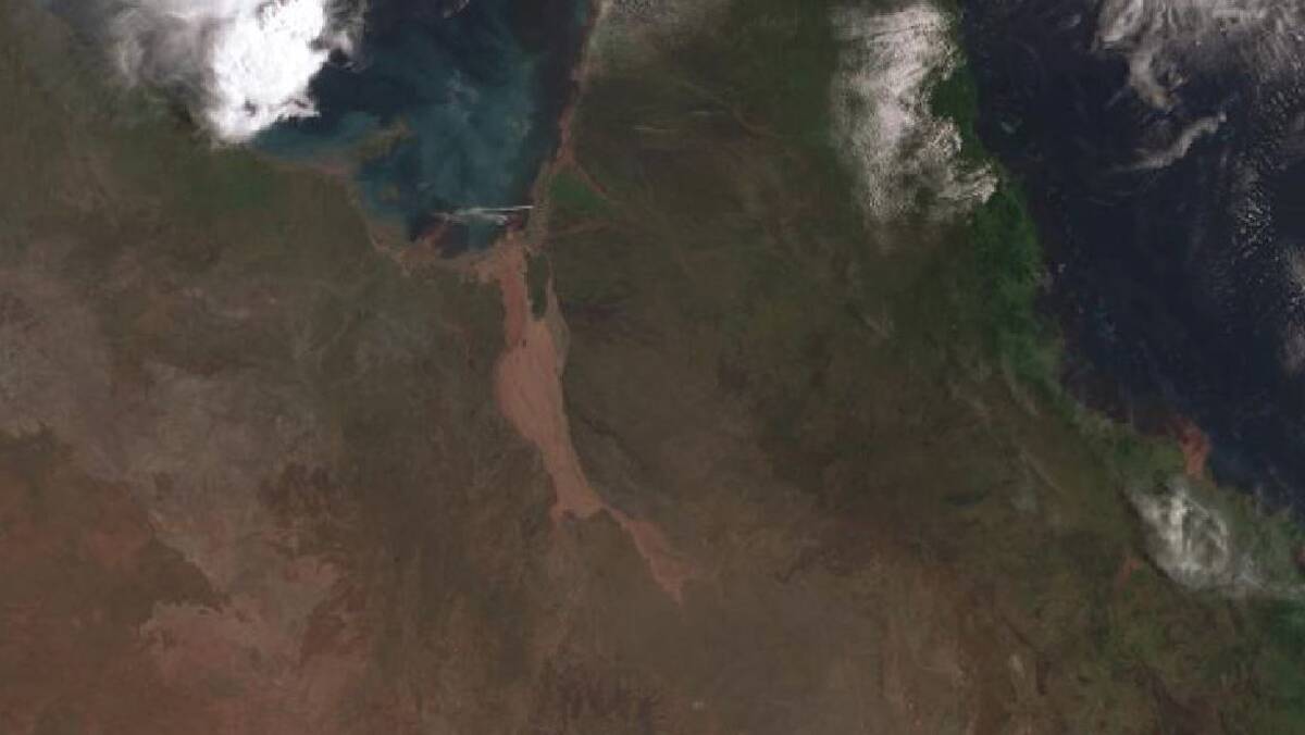 MAJOR FLOODING: The extent of the flooding heading towards the Lower Gulf is clearly visible on the satellite photos. Photo: BoM.