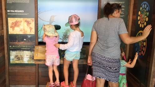 Visitors enjoy exhibits at the new Barramundi Discovery Centre.