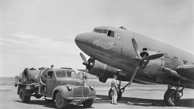 A US Air Force Douglas C47 waits to be refuelled at Cloncurry during the Second World War. Photo: Australian War Museum 