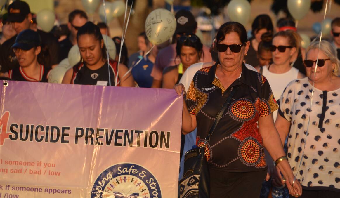 SUICIDE PREVENTION: The aim of the march on Monday night was plain to see. Photo: Derek Barry