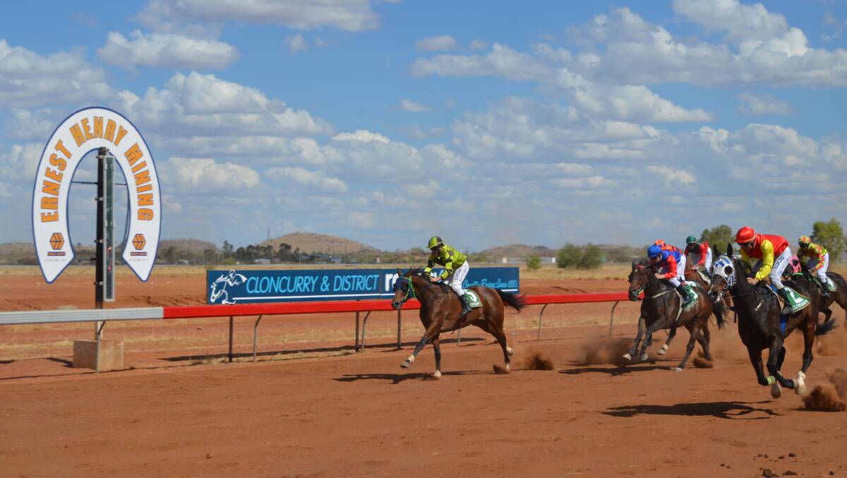 HOLY MOLY: Lee Attard leads Holey Gadoley on the outside (nearest the camera) to victory in the Cloncurry Cup Open for 2017. Photo: Derek Barry