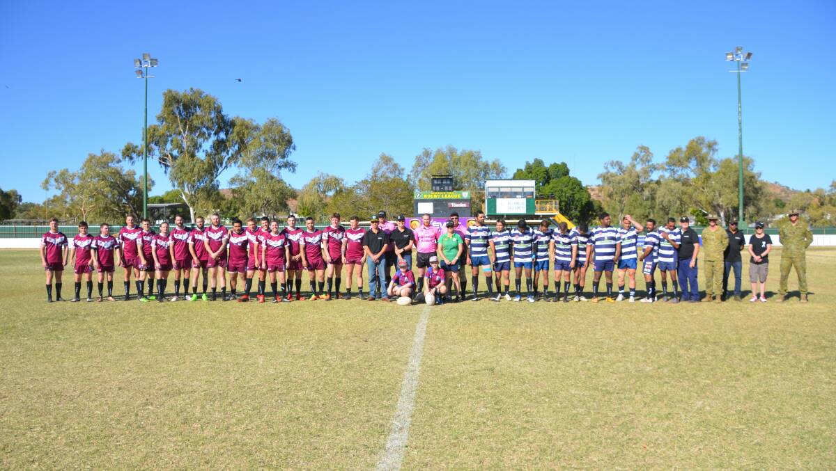 Players of Brothers and Town lined up in support of the message of White Ribbon Day against domestic violence at their game last Saturday.