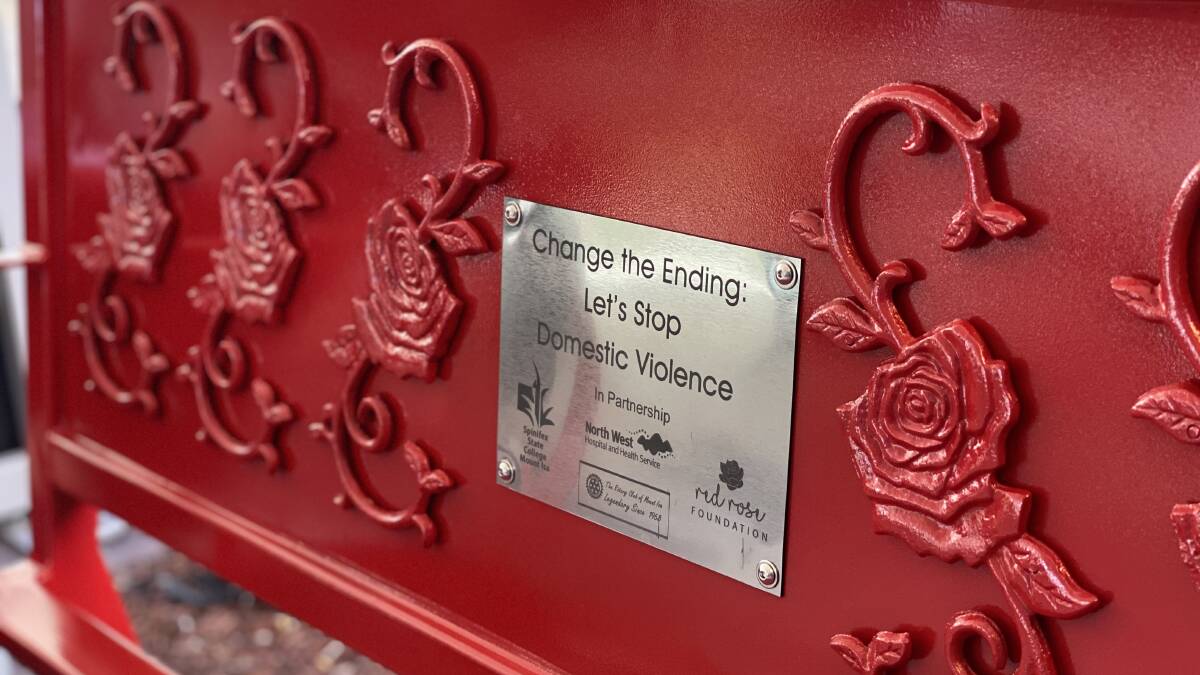 The plaque on the bench.