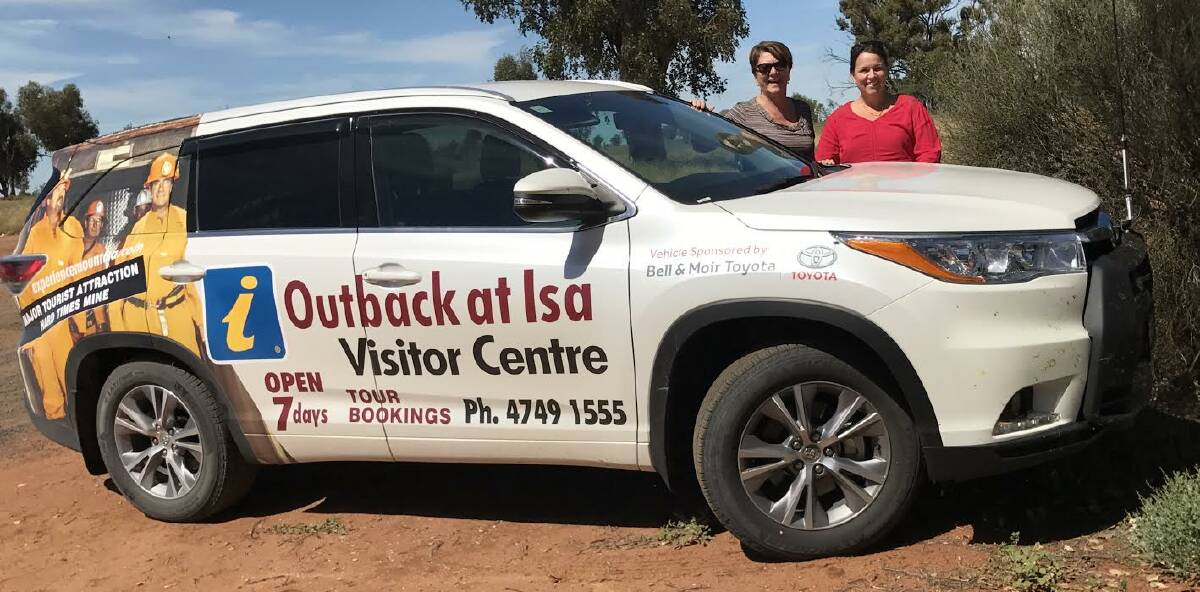 ROAD TRIP: Angi Matveyeff and Kylie Dent take the Outback at Isa Visitors Centre car to a tourism conference at Roma.