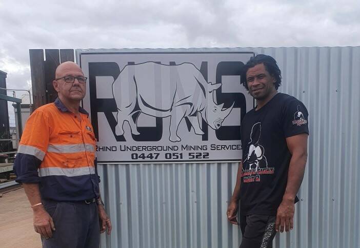 Mount Isa boxer Sunny Raitava (right) with Dave Ryan of sponsor RUMS.