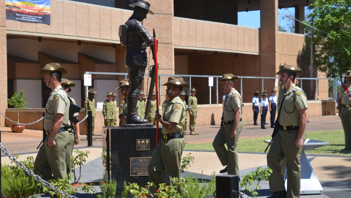 REMEMBER THEM: The catalfaque party guard the Mount Isa cenotaph during the 2018 Remembrance Day commemorations.