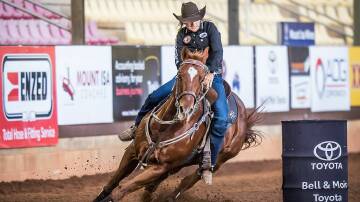 Leanne Caban leads the first section of the barrel races. Photos: Stephen Mowbray