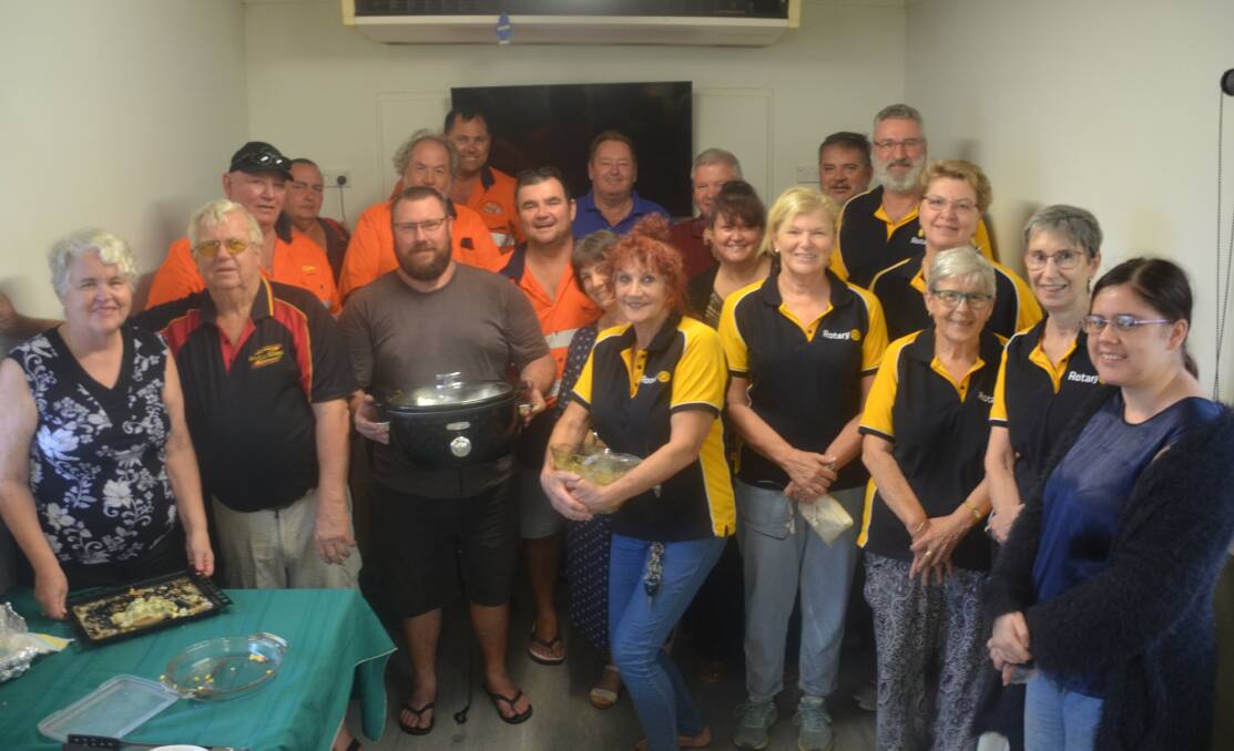GOOD DEEDS: Stranded truckies at the Shell truckstop enjoy a feed each night courtesy of the Rotary Club of Mount Isa. Photo: Derek Barry
