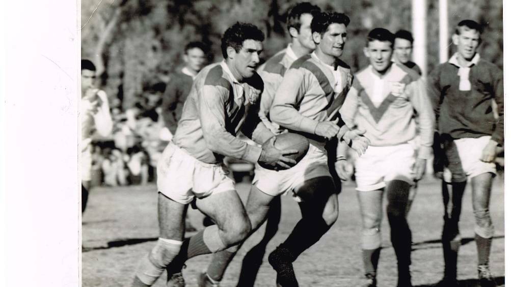 Terry Hammond with the ball in Mount Isa's first Foley Shield victory in 1969.