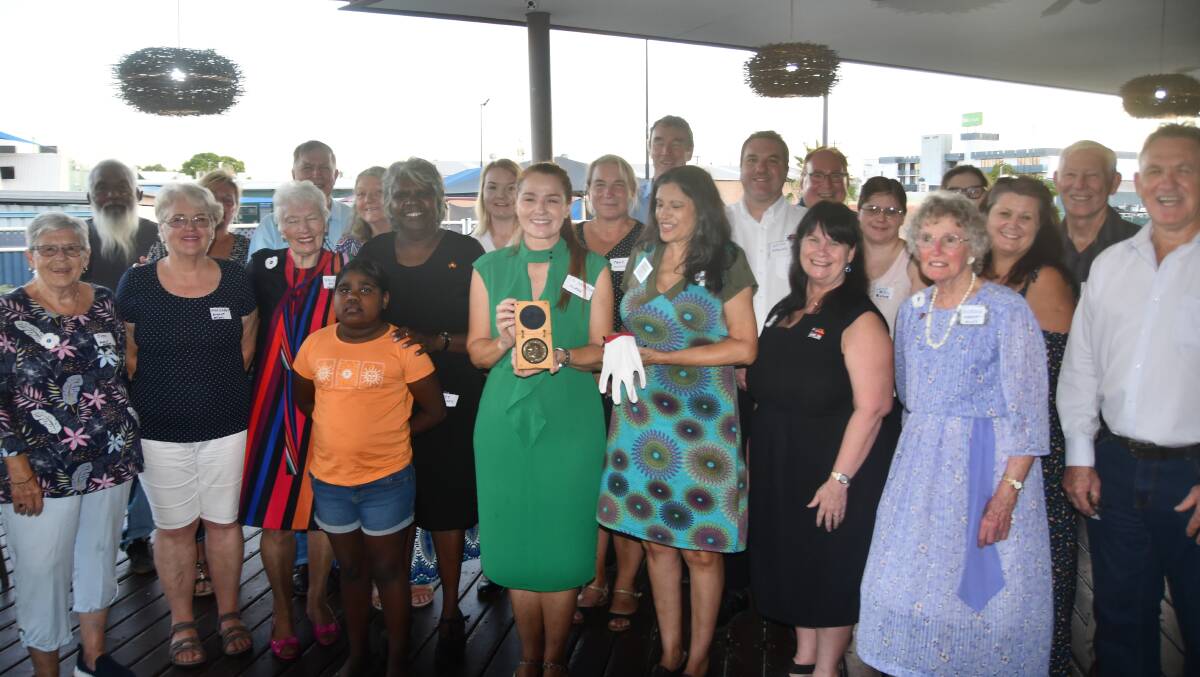 Mayor Danielle Slade holds the 2007 Nobel Peace Prize Medal with Dr Marianne Harrison and others at the Buffs Club on Tuesday.