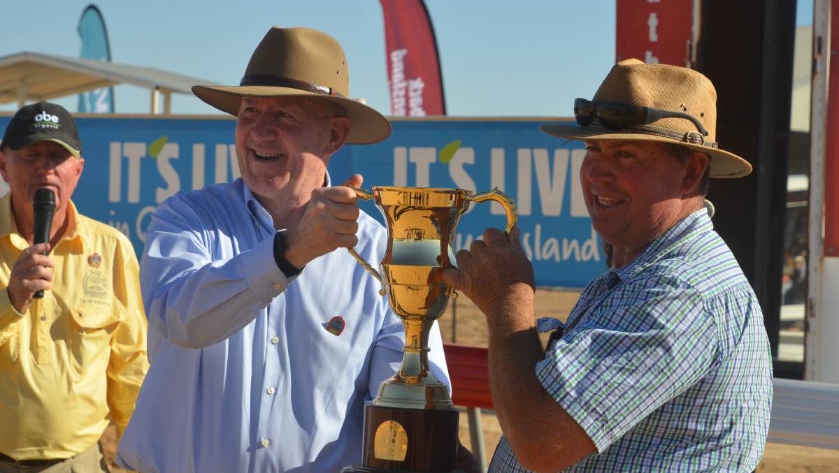 OUTBACK: Governor-General Sir Peter Cosgrove presents the 2017 Birdsville Cup to trainer Craig Smith. Photo: Derek Barry