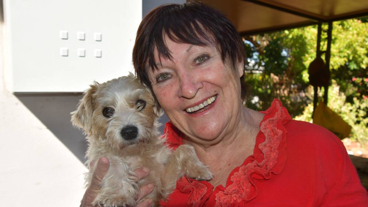 Sue Carson with her latest foster puppy Simba.