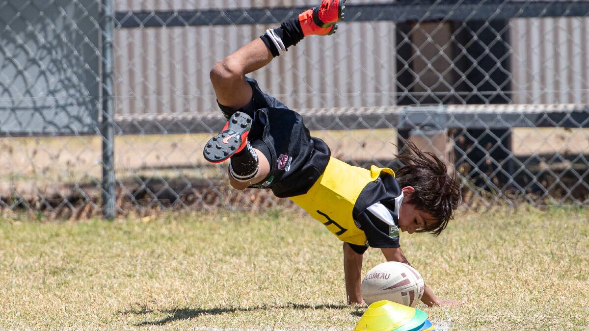 Kerry Brisbane captured this great photo of a youngster crashing over for a spectacular try in the junior league finals at Alec Inch Oval.