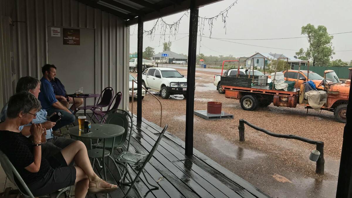 Travellers seek out refuge in the McKinlay Hotel while the road is cut off.