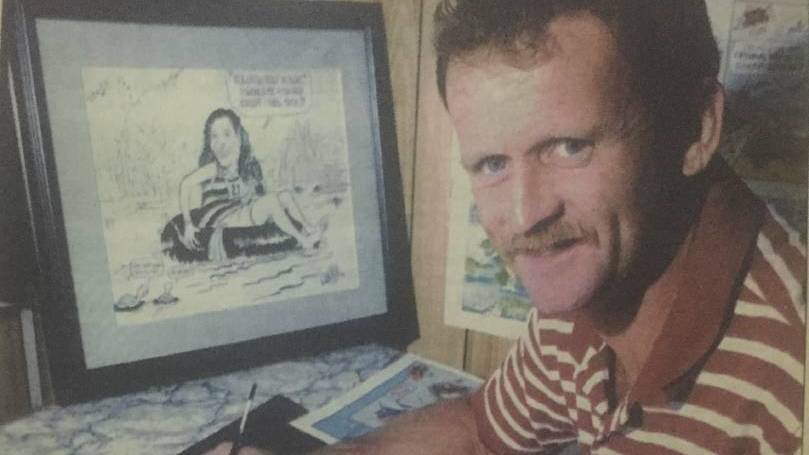 SADLY MISSED: Bret Currie at work in 1999 drawing a cartoon for the North West Star.