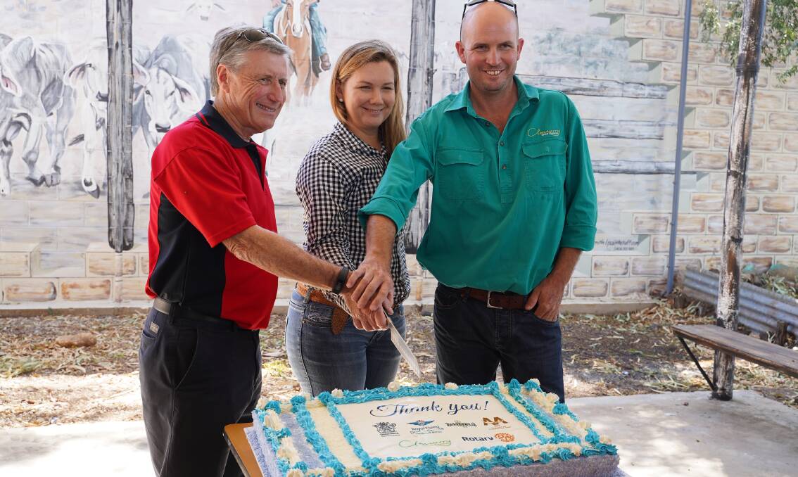 RFDS Qld Section chairman Mark Gray, Cheri Stanger (Burke and Wills Roadhouse) and Cloncurry Mayor Greg Campbell cut the cake to open the airstrip.
