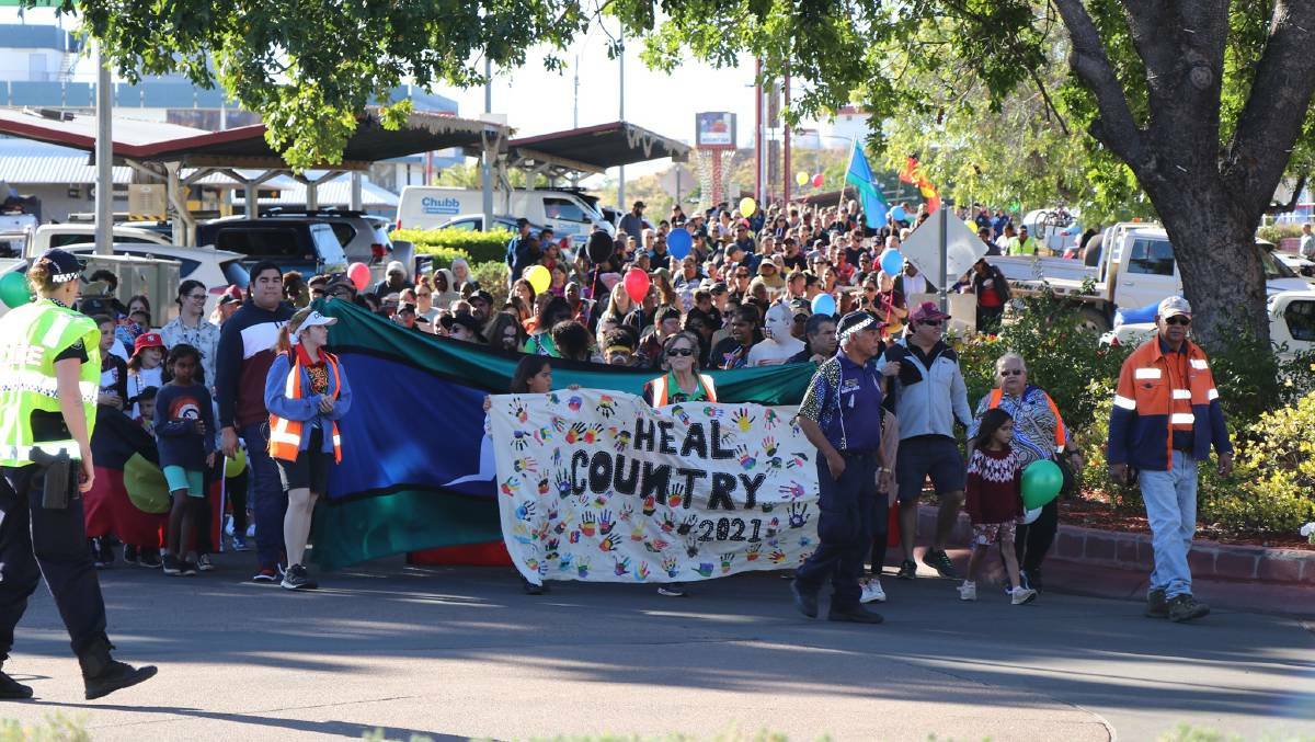 The community takes part in the 2021 Mount Isa Naidoc Week march.