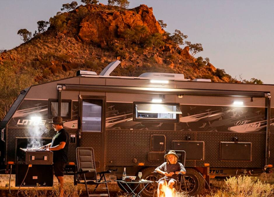 The cover photo of the latest Mount Isa City Council annual report shows tourists enjoying a barbecue while camping in the region.