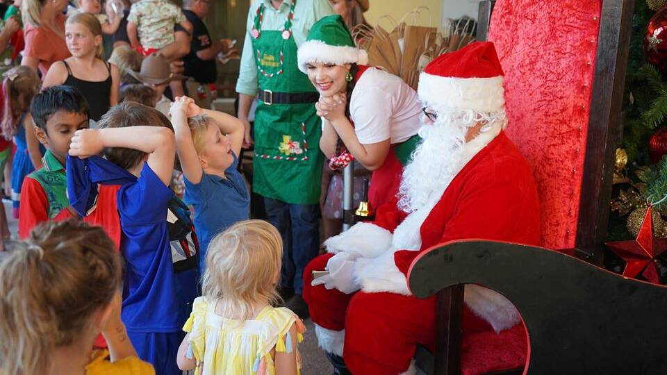 Kids check out Santa Claus at Cloncurry's Christmas celebrations on Monday. Photo: Cloncurry Shire Council.