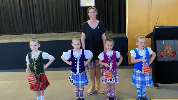 The Isa Highlanders (dancers seen here with adjudicator Amy Roach) held a dancing competition in Mount Isa on the weekend. Photo: Isa Highlanders