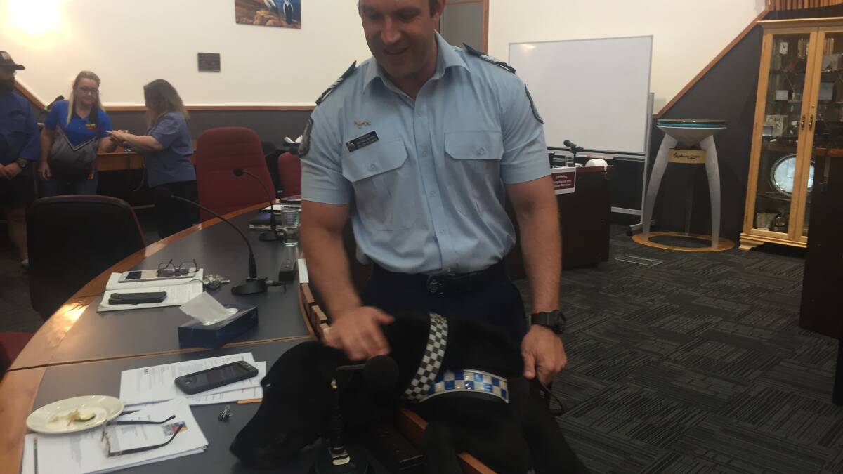 SNIFFER: Mount Isa Police Dog Flynn with handler Sergeant Michael Silman enjoyed checking out the surrounds at Mount Isa City Council on Wednesday. Photo: Derek Barry