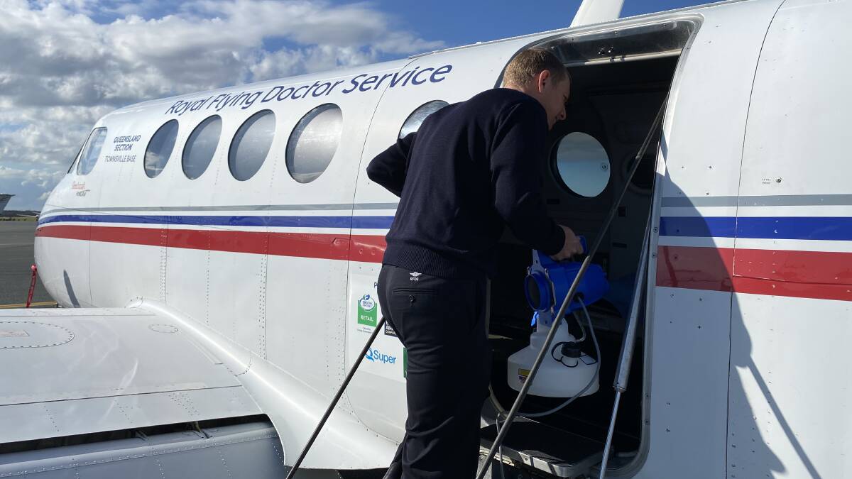 Clayton Judd fogs an RFDS plane using the new decontaminant. Photo: supplied
