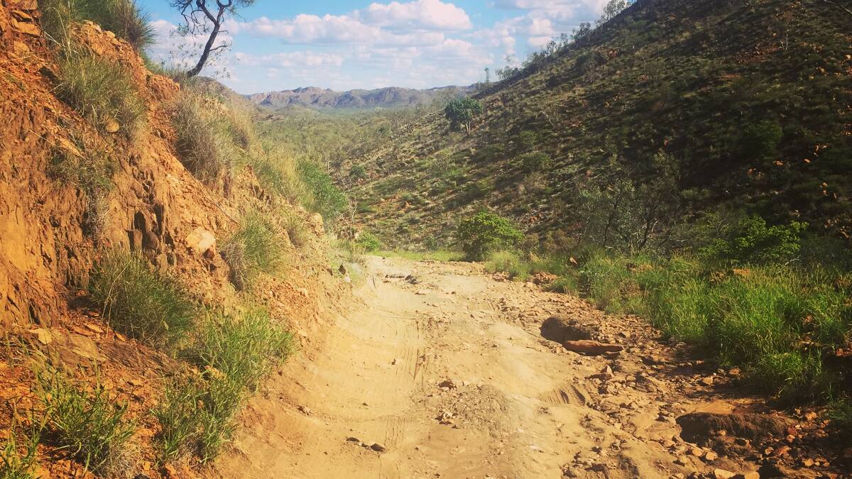 ROAD LESS TRAVELLED: The rough 4WD track down the hill towards Rigby Falls, 50km east of Mount Isa. Photo: Derek Barry