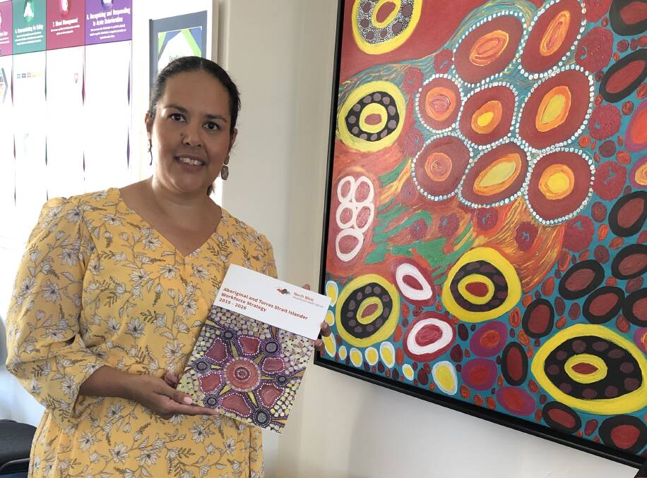 Executive Director Aboriginal and Torres Strait Islander Health, Christine Mann, with the Aboriginal and Torres Strait Islander Workforce Strategy.