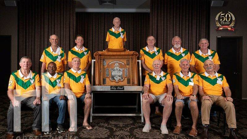 FIFTY YEARS ON: John Moran (back) with 11 of the 18 players who played in Mount Isa's first Foley Shield win in 1969 (absent from photo Kev Duve). Photo: Robert Hiette