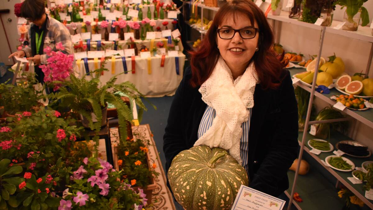 Cr Vicky Campbell with a pumpkin entered in the 2018 Cloncurry Show. This year's show will be visual entry only.