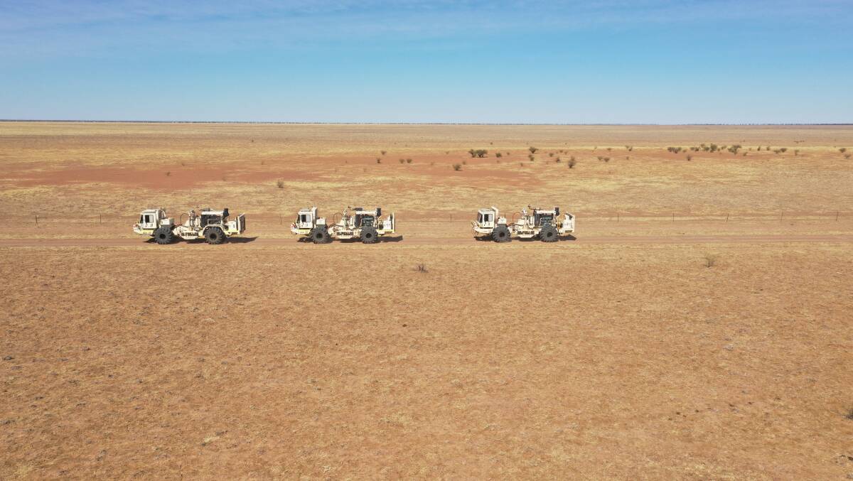 Seismic trucks conduct a survey in the North West Minerals Province.