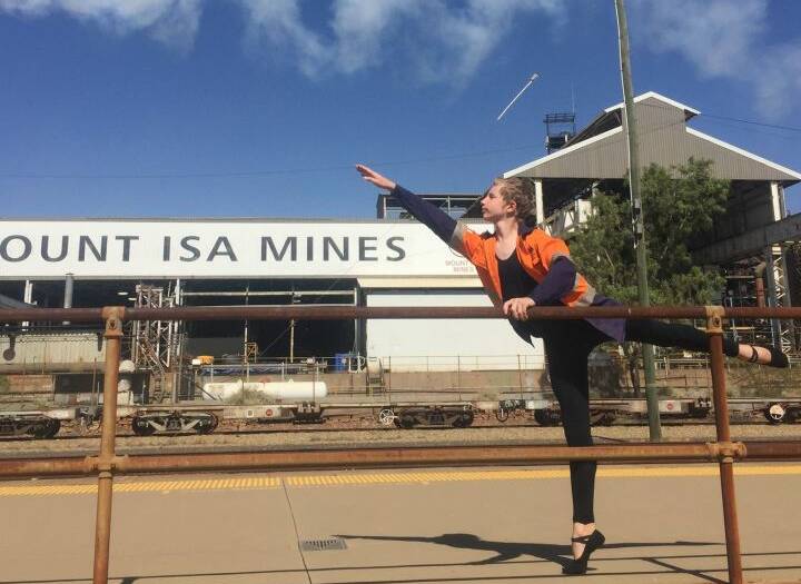 Will performs an arabesque outside Mount Isa Mines for the Suncorp Dream Big Challenge