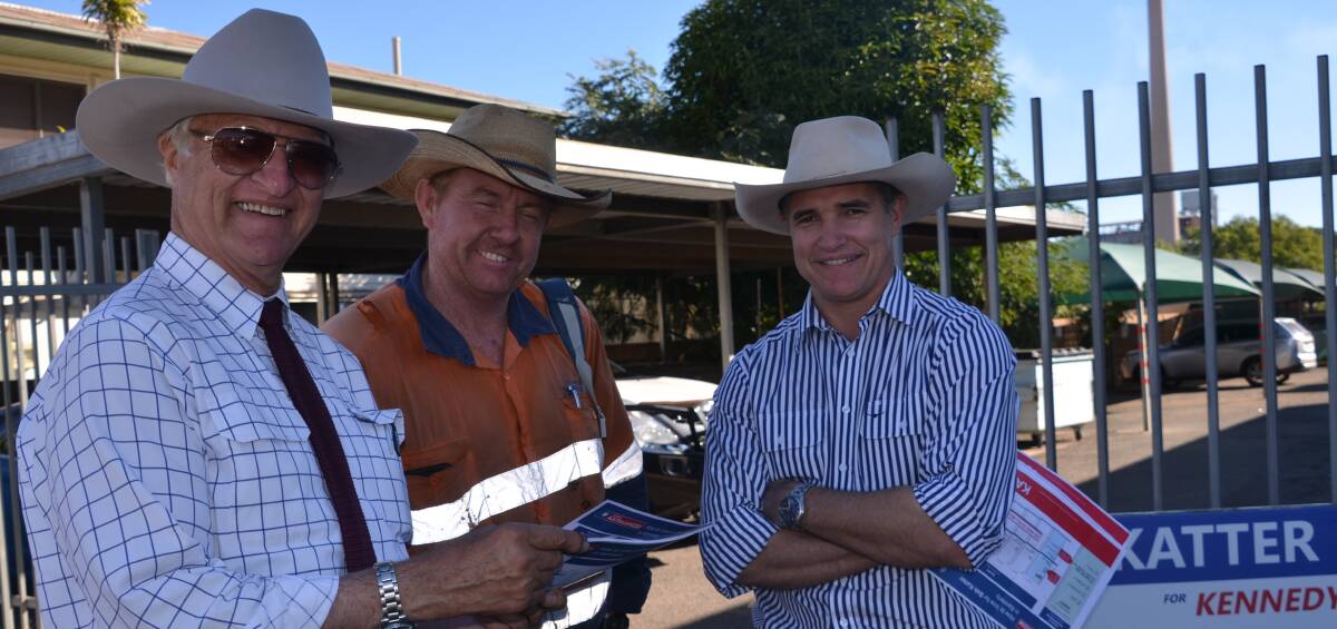 WINNER GRINNER: Bob Katter chats with Ian Fletcher and Robbie Katter at Mount Isa's pre-poll centre on Friday.