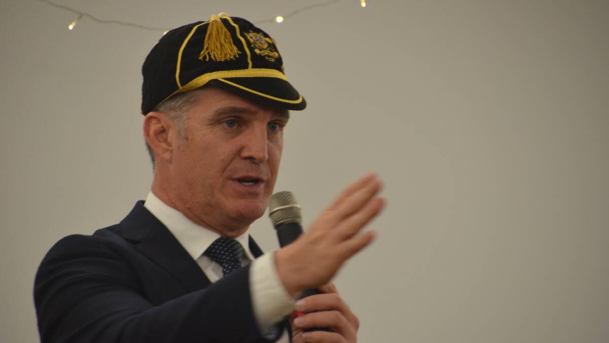 IF THE CAP FITS: Australian rugby legend dons his Australian cap to make a point at the Cattlemen's Dinner. Photo: Derek Barry