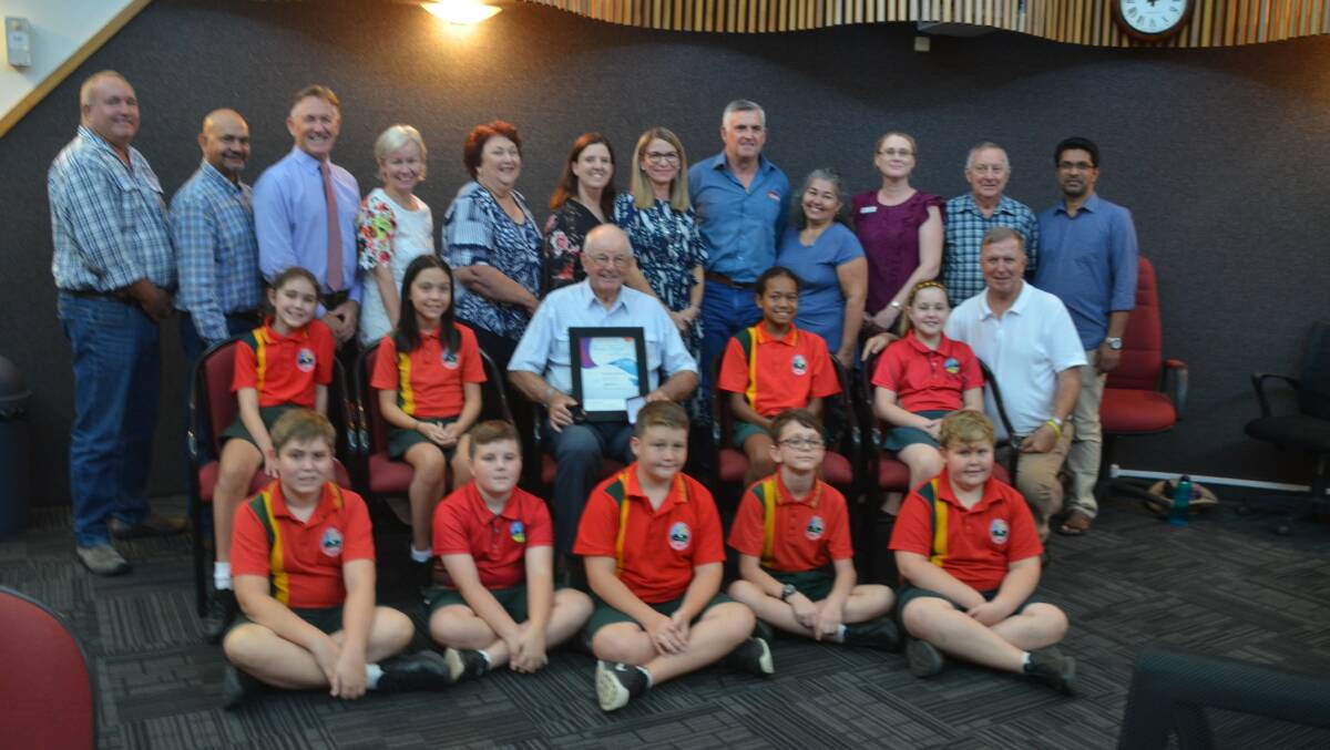 Mount Isa city councillors and St Kieran's teachers and students with Senior Citizen of the Year Br Lou Walker.