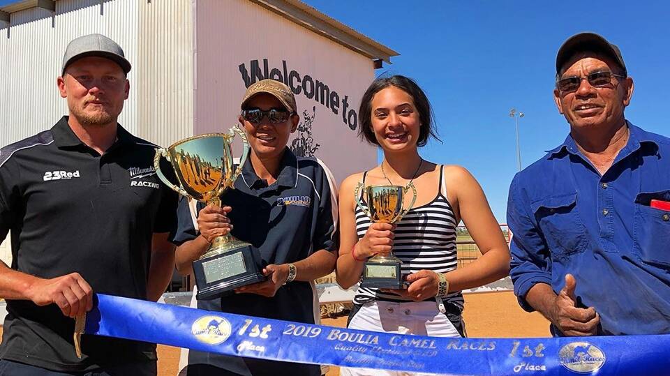 CAMEL WIN: Wason won for Boulia camel trainers Dannileah Stewart (with cup) and Ronnie Callope (right) with Charleville based jockey Tiana Taratoa. Photo: Boulia Camel Races