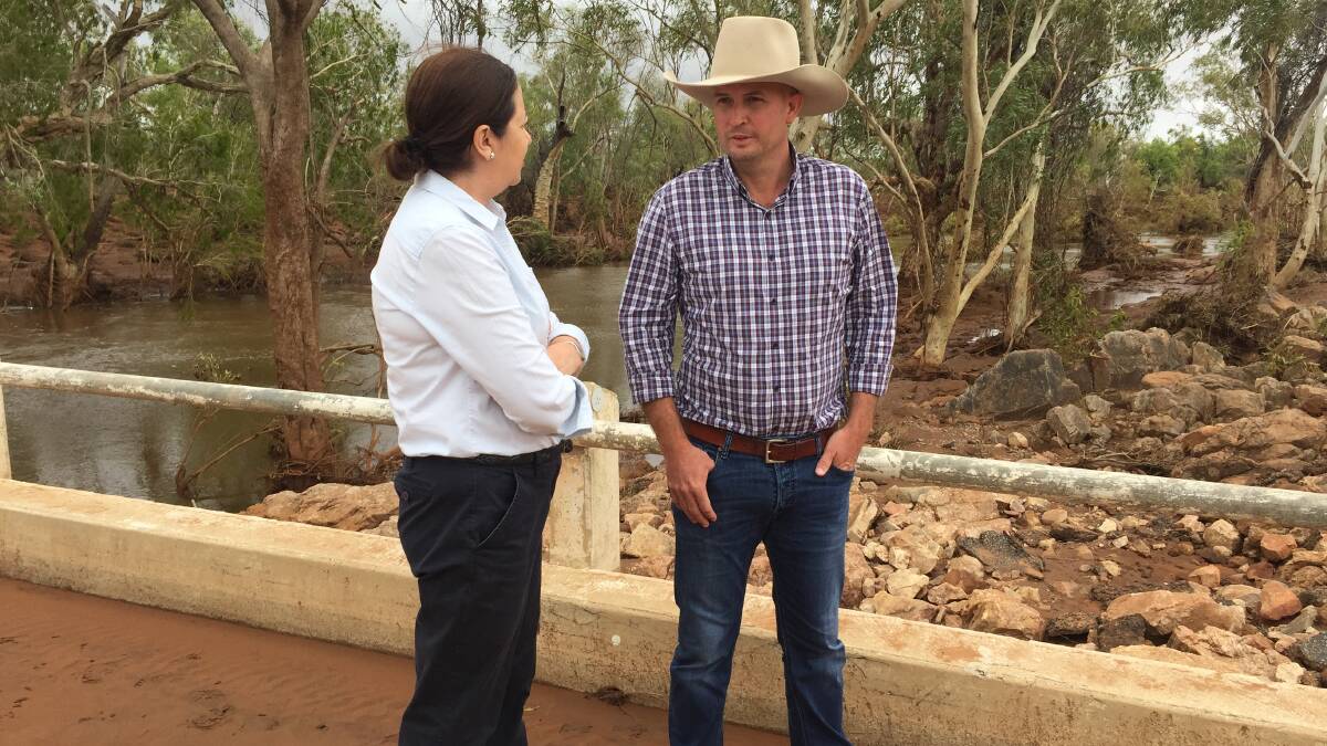 Premier Annastacia Palaszczuk discusses the stock situation with Cloncurry Mayor Greg Campbell on Thursday.