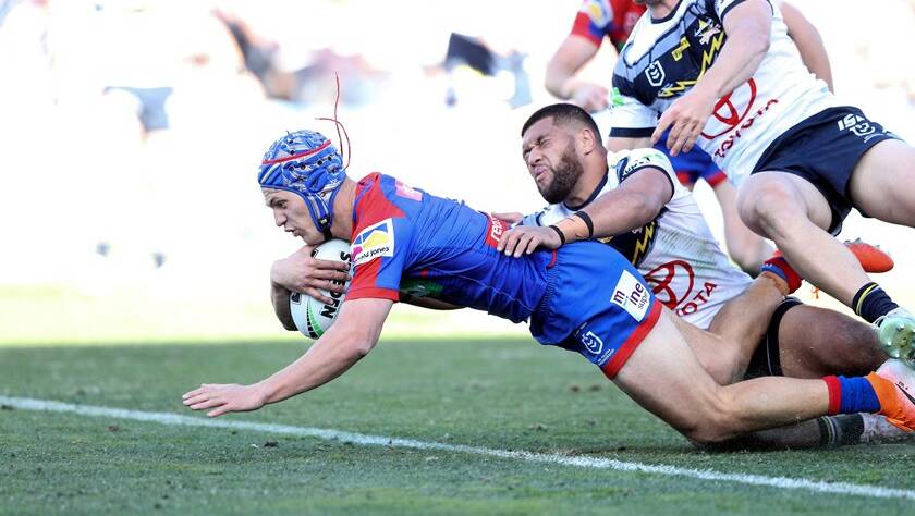 Knights star Kalyn Ponga crosses for a try. Photo: Shane Myers/NRL Photos
